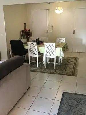 a dining room with a table and four chairs at Nice port quartier antiquaire in Nice