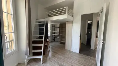a small room with a loft bed and a staircase at Cosy Family trip in Nice