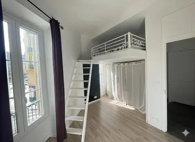 a room with a loft bed and a ladder at Cosy Family trip in Nice
