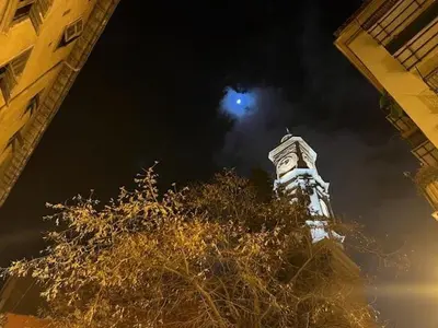 a clock tower at night with the moon in the sky at New ! Charmant spacieux 2p Vieux-Nice calme in Nice