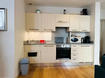 a kitchen with white cabinets and a sink and a microwave at New ! Charmant spacieux 2p Vieux-Nice calme in Nice