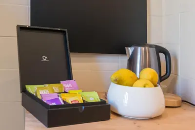 a box of fruit next to a blender on a counter at Guest House Chez Bastien in Nice