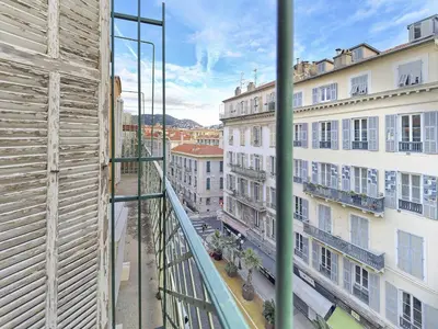 a view of a street from a balcony of a building at Hyper Centre - Charming duplex - Luxury - Reversible air conditioning - 10 mins from Place MASSENA in Nice