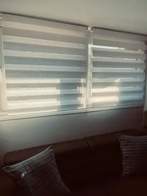 a window with the blinds open in a living room at Duplex Élégant au Cœur de Nice in Nice