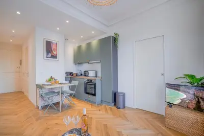 a kitchen and dining room with a table and a counter at Maison Bianchi - Avenue Durante - Downtown Top floor in Nice