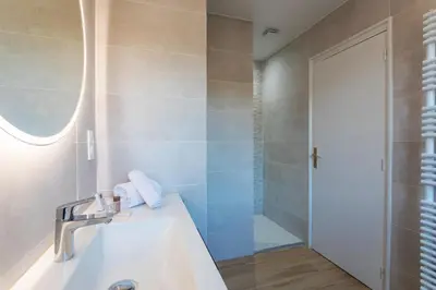 a bathroom with a sink and a shower at LE SAINT ESTEVE AP4435 By Riviera Holiday Homes in Villefranche-sur-Mer