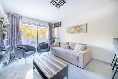 a living room with a couch and a table at Superbe 3 pieces Nice 100m de la mer in Nice