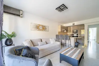 a living room with a couch and a table at Superbe 3 pieces Nice 100m de la mer in Nice