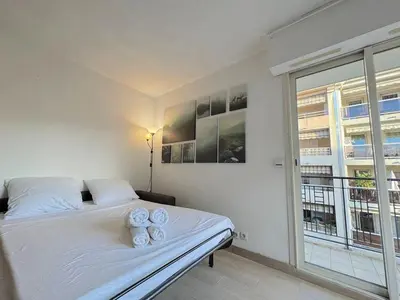 a bedroom with a bed with two teddy bears on it at ⁂ Calme et ensoleillé balcon quartier Port Nice in Nice