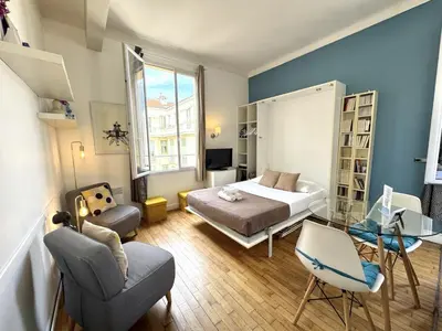 a bedroom with a bed and a glass table at ApartHotel Riviera - LE COCON DE VICTOR - Grimaldi - Promenade des Anglais in Nice