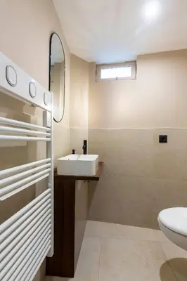 a bathroom with a sink and a toilet at Loft Spacieux pour 10 personnes avec Terrasse in Nice