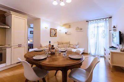 a kitchen and living room with a table and chairs at HEAVEN AP4440 By Riviera Holiday Homes in Villefranche-sur-Mer
