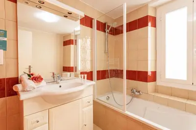 a bathroom with a sink and a shower at HEAVEN AP4440 By Riviera Holiday Homes in Villefranche-sur-Mer