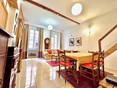 a dining room with a table and chairs at ApartHotel Riviera - MAISON DU CHATEAU - Old town - Promenade des Anglais in Nice