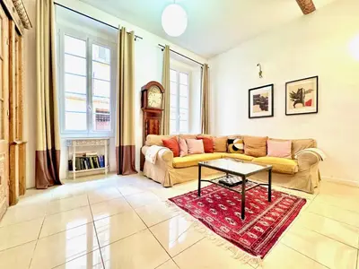 a living room with a couch and a table at ApartHotel Riviera - MAISON DU CHATEAU - Old town - Promenade des Anglais in Nice
