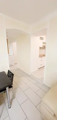 a white room with a table and a chair at Appartement 3 pièces sur Nice Centre in Nice