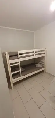 a room with bunk beds in a white room at Appartement 3 pièces sur Nice Centre in Nice