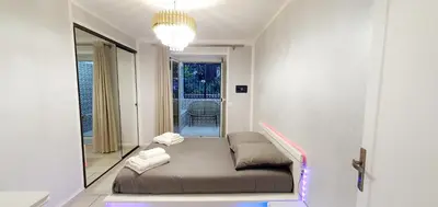 a room with a bed with a mirror in it at Appartement 3 pièces sur Nice Centre in Nice
