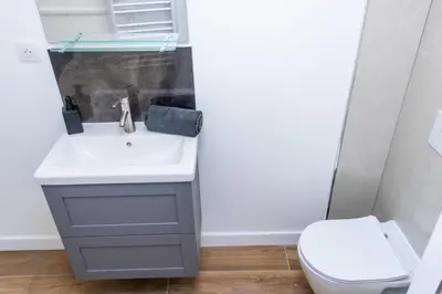 a bathroom with a sink and a toilet at NIce proche mer in Nice