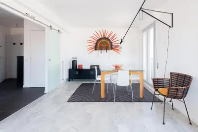 a dining room with a table and two chairs at Happyfew Fodere in Nice