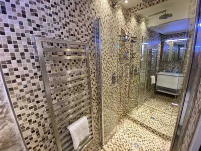 a bathroom with a shower with mosaic tiles at COCON AP4446 By Riviera Holiday Homes in Villefranche-sur-Mer