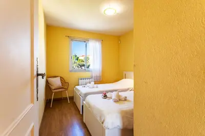 a room with two beds and a window at LE JARDIN BLEU AP4388 By Riviera Holiday Homes in Nice