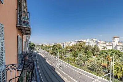 a balcony of a building with a view of a city at 2 chambres, balcons, vue imprenable, climatisation - PALACE BLEU in Nice