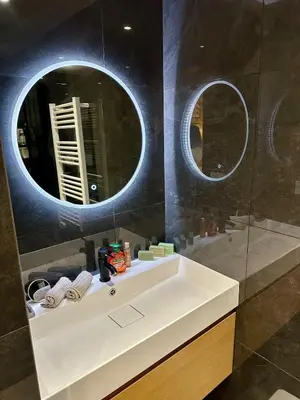 a bathroom with a white sink and two mirrors at 2 chambres, balcons, vue imprenable, climatisation - PALACE BLEU in Nice