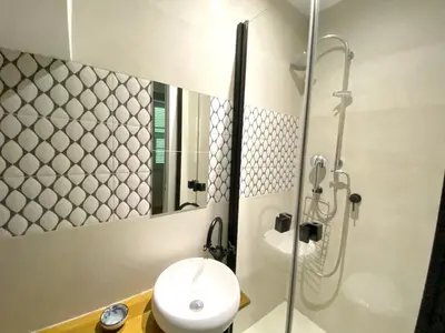 a bathroom with a shower and a toilet and a sink at PEARL AP4444 By Riviera Holiday Homes in Villefranche-sur-Mer