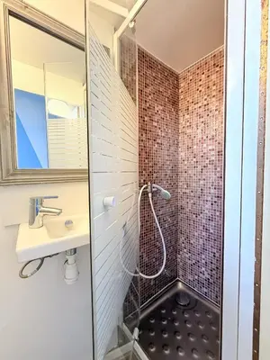 a bathroom with a shower and a sink at PORT - Charmant Studio in Nice