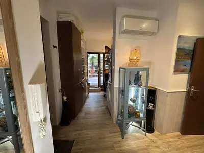 a hallway of a house with a glass cabinet at Promenade des Anglais With AC Near Negresco in Nice