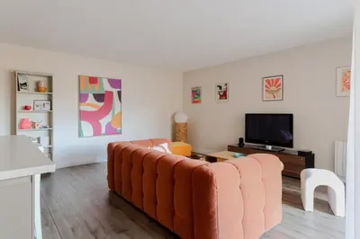 a living room with a couch and a tv at Appartement cosy Cagnes-sur-Mer in Cagnes-sur-Mer