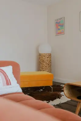 a living room with a couch and a table at Appartement cosy Cagnes-sur-Mer in Cagnes-sur-Mer