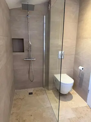 a bathroom with a shower with a toilet and a sink at Maison avec jacuzzi privatif dans résidence in La Gaude