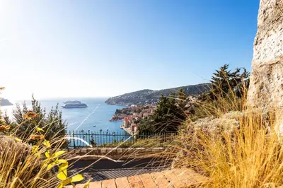 a view of the amalfi coast with a cruise ship at CASA ROSALIE VI4442 By Riviera Holiday Homes in Villefranche-sur-Mer