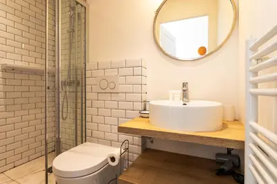 a bathroom with a sink and a mirror at CASA ROSALIE VI4442 By Riviera Holiday Homes in Villefranche-sur-Mer