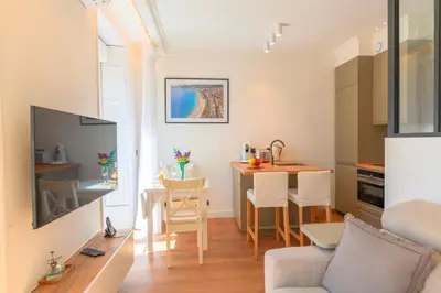 a small apartment with a kitchen and a living room at Hyper Centre, balcon, 5min de la plage, AC in Nice