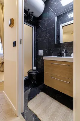 a bathroom with a sink and a mirror at Ultra Central 1 Bdr - AC in Nice