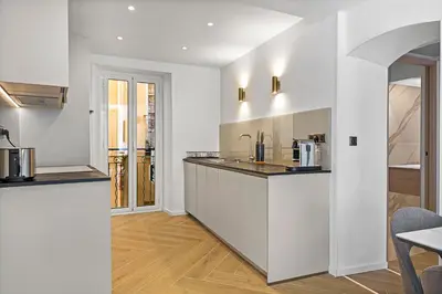 a kitchen with white walls and a counter top at Saint-Augustin - Nice Old Town in Nice