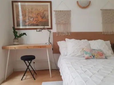 a bedroom with a white bed and a desk at 3 rooms GEM in Old Town Nice in Nice