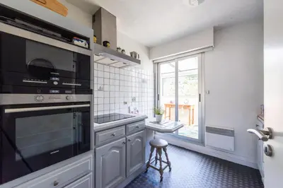 a kitchen with a sink and a stove top oven at Happyfew la terrasse de Selfina in Nice