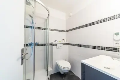 a bathroom with a shower and a toilet and a sink at Happyfew la terrasse de Selfina in Nice