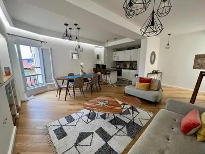 a living room with a couch and a table at LARA AP4441 By Riviera Holiday Homes in Villefranche-sur-Mer