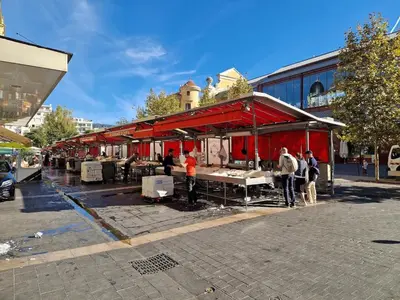 a group of people standing outside of a red building at Studio with Big terrace full center with air conditioning in Nice