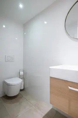 a bathroom with a toilet and a sink and a mirror at Le Castelosa - Au coeur du Vieux-Nice in Nice