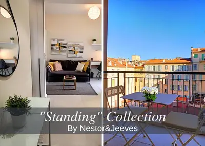 a living room and a balcony with a couch and a table at Nestor&Jeeves - KORNER AVENUE TERRASSE - Central - Balcony in Nice