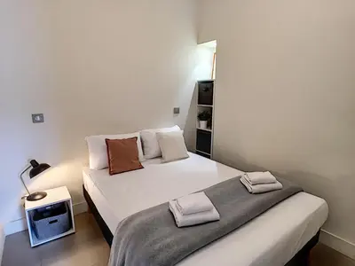 a bedroom with two beds with towels on them at Nestor&Jeeves - KORNER AVENUE TERRASSE - Central - Balcony in Nice
