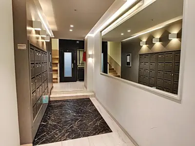 a walk in closet with dark cabinets and a black floor at Nestor&Jeeves - KORNER AVENUE TERRASSE - Central - Balcony in Nice