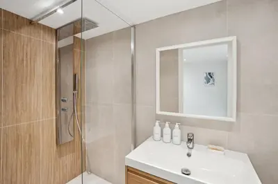 a bathroom with a sink and a shower at La Promenade Niçoise in Nice