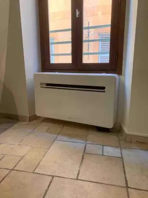 a room with a radiator and a window at Proche du Cours Saleya et de la plage, dans le vieux Nice, spacieux et climatisé in Nice
